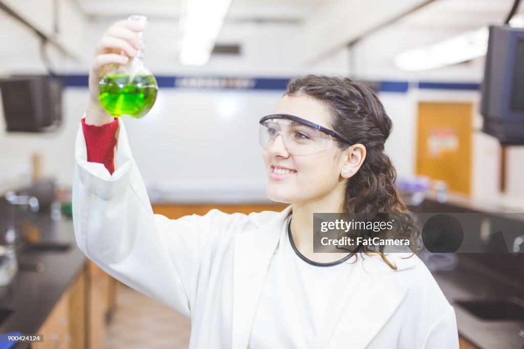 Female Works in High School Science Lab