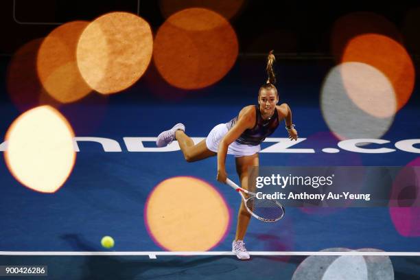 Jade Lewis of New Zealand serves in her match against Viktoria Kuzmova of Slovakia during day two of the ASB Women's Classic at ASB Tennis Centre on...