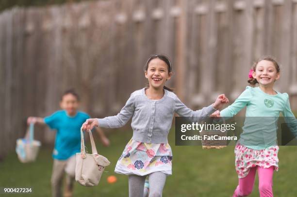 backyard easter egg hunt! - easter hunt stock pictures, royalty-free photos & images