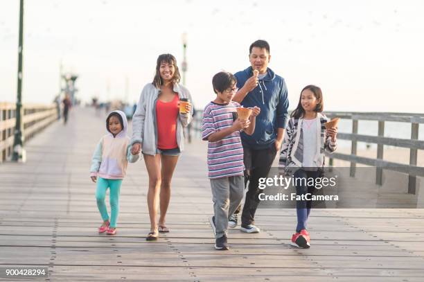 ice cream on the boardwalk! - filipino family eating stock pictures, royalty-free photos & images