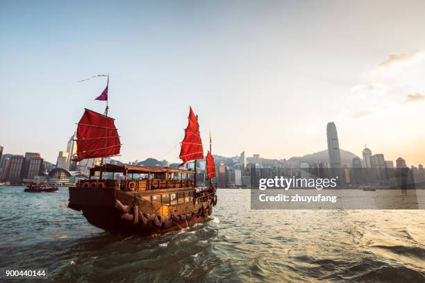 traditional junk boat at the victoria harbour - junk ship stock pictures, royalty-free photos & images