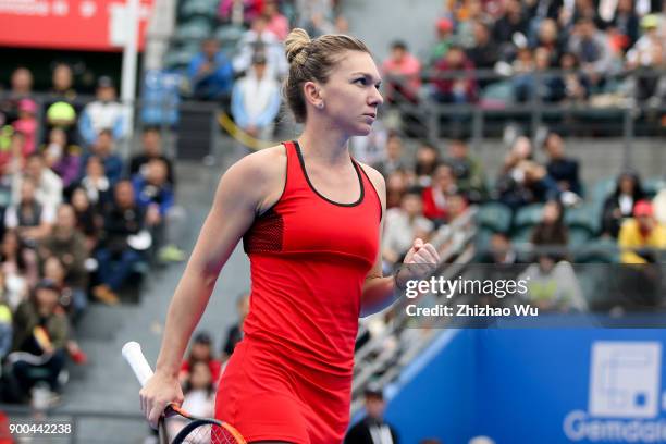 Simona Halep of Romania reacts during her match against Nicole Gibbs of the United States during day two of 2018 WTA Shenzhen Open at Longgang...