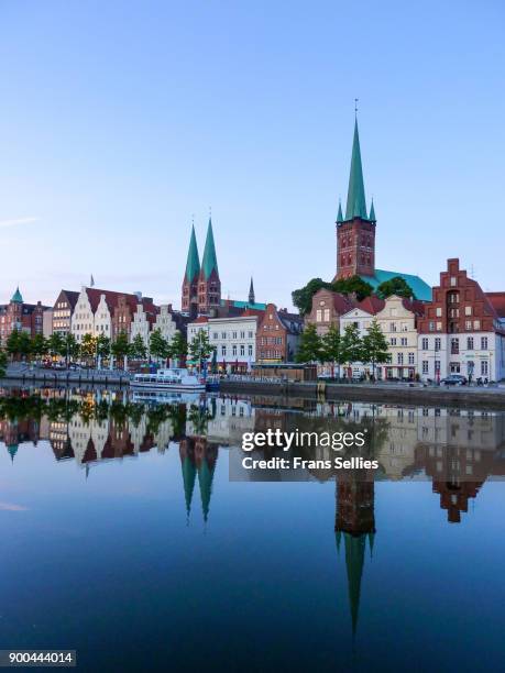 trave river and the historic centre of lübeck, germany - lübeck stock-fotos und bilder