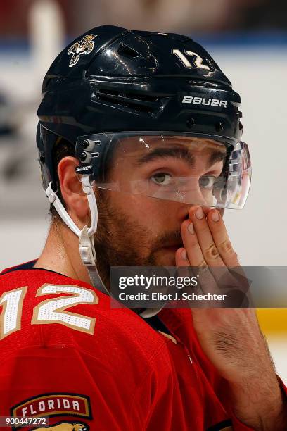 Ian McCoshen of the Florida Panthers stretches on the ice prior to the start of the game against the Montreal Canadiens at the BB&T Center on...