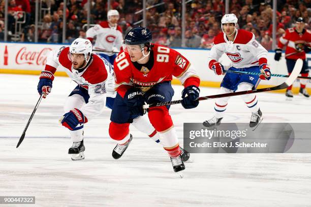 Jared McCann of the Florida Panthers skates for position against Phillip Danault of the Montreal Canadiens at the BB&T Center on December 30, 2017 in...