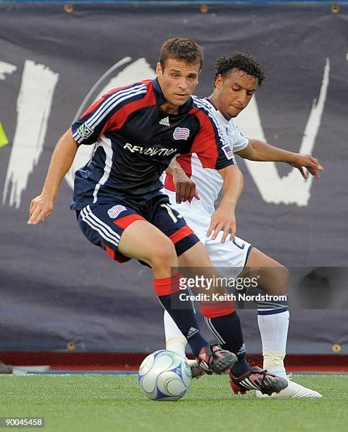 Michael Videira of the New England Revolution drives the ball in front of Rachid El Khalifi of Real Salt Lake during the MLS match August 23, 2009 at...
