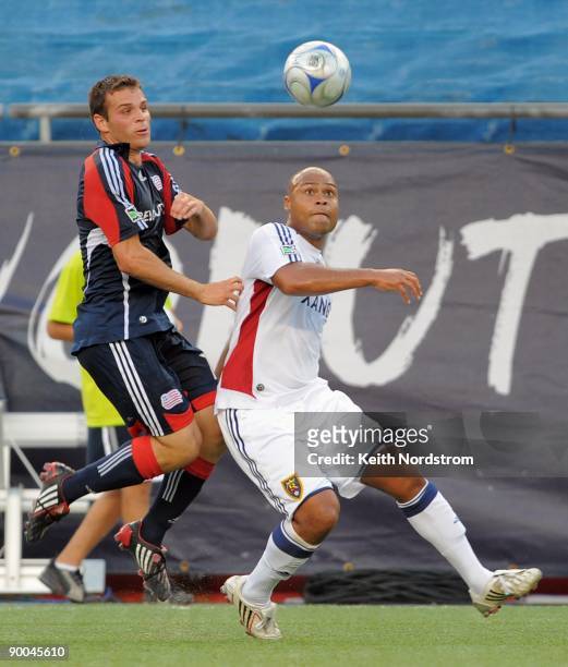 Michael Videira of the New England Revolution eyes the ball with Robbie Russell of Real Salt Lake during the MLS match August 23, 2009 at Gillette...
