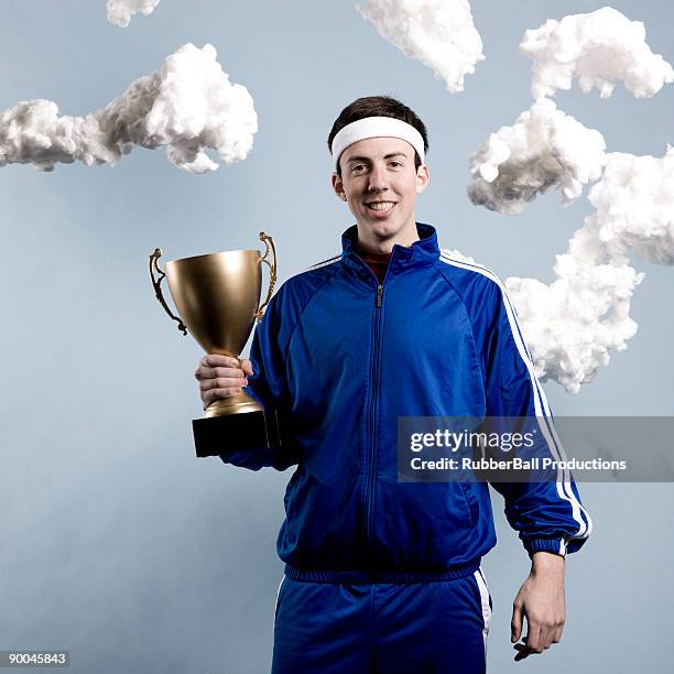 jogger holding a trophy - tracksuit stock pictures, royalty-free photos & images