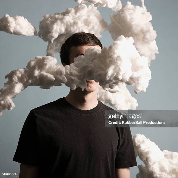 man standing in a cloud of smoke - distraído imagens e fotografias de stock