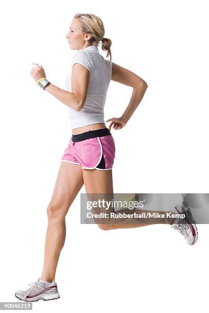 woman in pink running shorts - running shorts foto e immagini stock