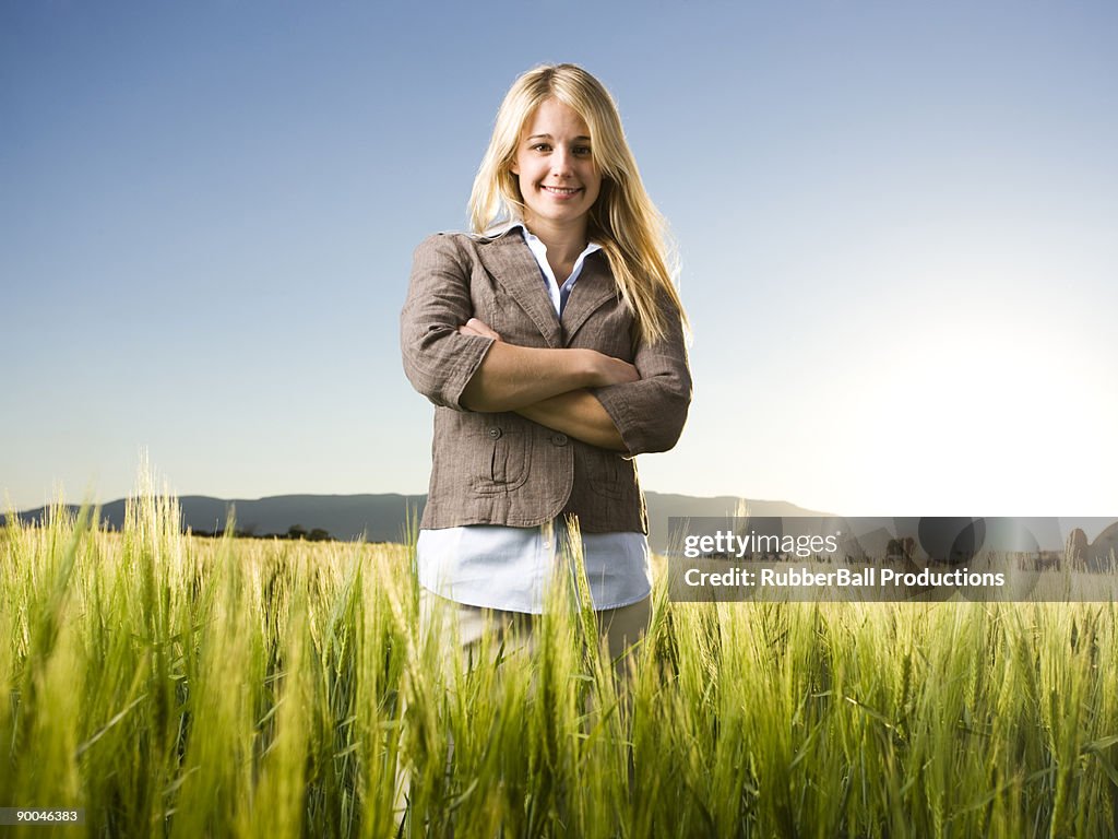 Businesswoman standing in a field