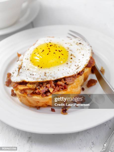 bacon jam with a fried egg on thick toast - thick bacon stock pictures, royalty-free photos & images
