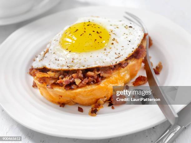 bacon jam with a fried egg on thick toast - thick bacon stock pictures, royalty-free photos & images
