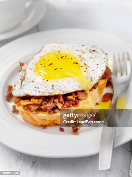 bacon jam with a fried egg on thick toast - thick bacon stock pictures, royalty-free photos & images