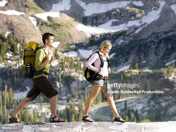 young couple on a hiking trip - alta utah stock pictures, royalty-free photos & images