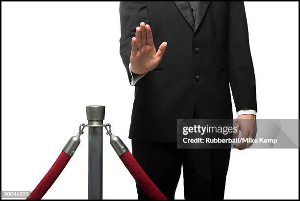 man in a tuxedo denying entry through a velvet rop - roped off stock pictures, royalty-free photos & images