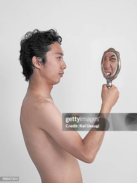 a portrait of naked man. - double face photos et images de collection