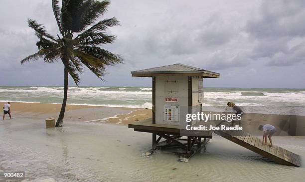 Ocean water caused by high waves from Hurricane Michelle floods the base of a life guard station along the beach November 5 in Hollywood Beach,...