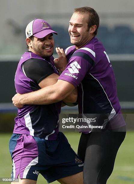 Greg Inglis of the Storm is tackled by team-mate Scott Anderson during a Melbourne Storm NRL training session at Visy Park on August 25, 2009 in...