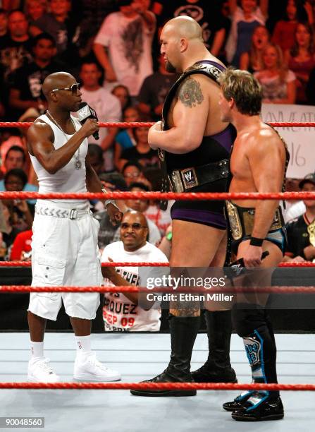 Boxer Floyd Mayweather Jr. Appears in the ring with wrestlers Big Show and Chris Jericho during the WWE Monday Night Raw show at the Thomas & Mack...