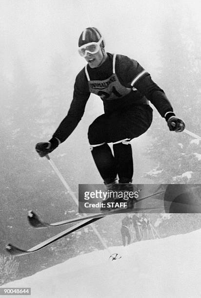 This file picture taken on January 11, 1956 shows Austrian skier Toni Sailer competing during a downhill run in Wengen. Sailer, nicknamed "Blitz from...