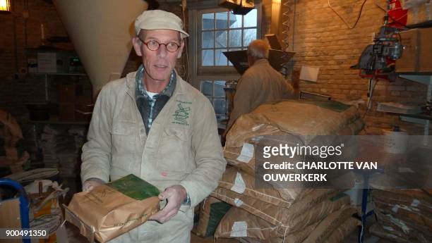 Maarten Dolman one of the last Dutch millers looks on at his mill in Ijsselstein, in the province of Utrecht, The Netherlands on December 14, 2017. /...