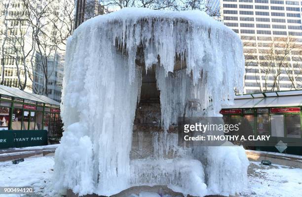 The frozen Josephine Shaw Lowell Memorial Fountain located at Bryant Park in New York is viewed on January 2, 2018 as New Yorkers return back to work...