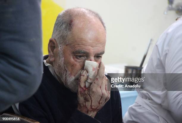 Man receives medical treatment at a military hospital after getting injured by an airstrike, carried out by Assad Regime Forces, hit a marketplace in...