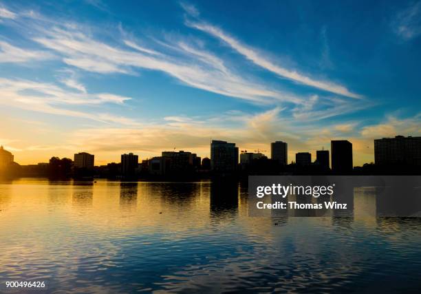 highrise buildings and lake merritt - oakland california skyline stock pictures, royalty-free photos & images