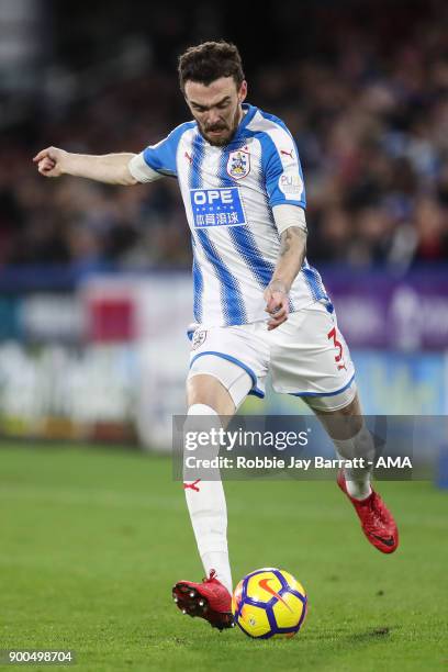 Scott Malone of Huddersfield Town during the Premier League match between Huddersfield Town and Burnley at John Smith's Stadium on December 30, 2017...