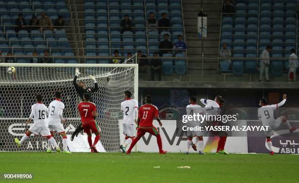 Bahrain's Mahdi Abd al-Jaber scores an own goal during the 2017 Gulf Cup of Nations semi-final football match between Oman and Bahrain at the Sheikh...