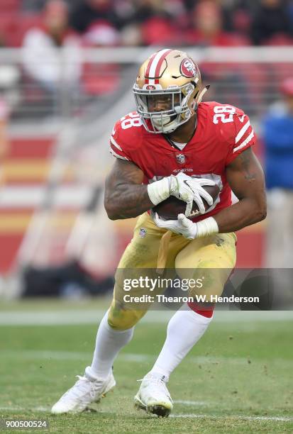 Carlos Hyde of the San Francisco 49ers carries the ball against the Jacksonville Jaguars during their NFL football game at Levi's Stadium on December...