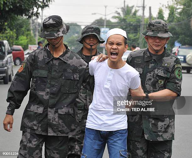 Dino Amor Pareja the leader of the Rajah Solaiman Movement, a group of Christians who converted to become Islamic militants, shouts "Allah Akbar" as...