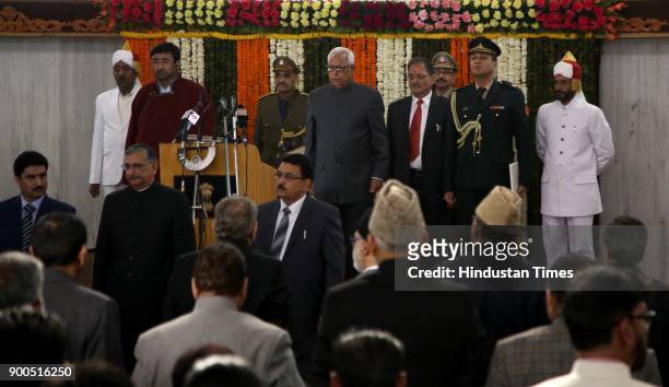 Jammu and Kashmir Governor NN Vohra and MLA's stand for national anthem after the address to the joint session of the bicameral legislature on the...