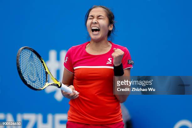 Zarina Diyas of Kazakhstan celebrates during the match against Shuai Zhang of China during Day 3 of 2018 WTA Shenzhen Open at Longgang International...