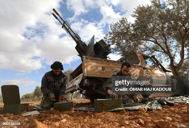 Opposition fighters prepare ammunition in the al-Mushrifa area, near the town of Khan Sheikun in Syria's northwestern rebel-held province of Idlib,...