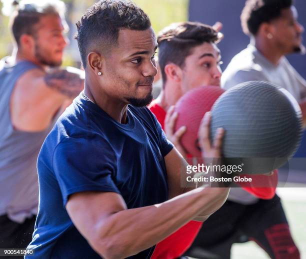 Boston Red Sox player Xander Bogaerts does medicine ball exercises while training at EXOS, an elite athlete training center in Phoenix, AZ on Dec....