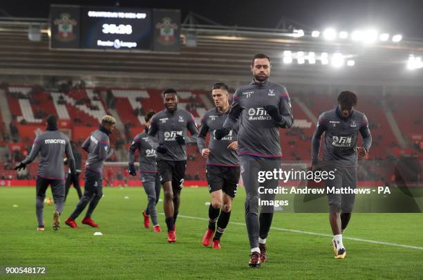 Crystal Palace's Damien Delaney and team-mates warm up before the Premier League match at St Mary's Stadium, Southampton.