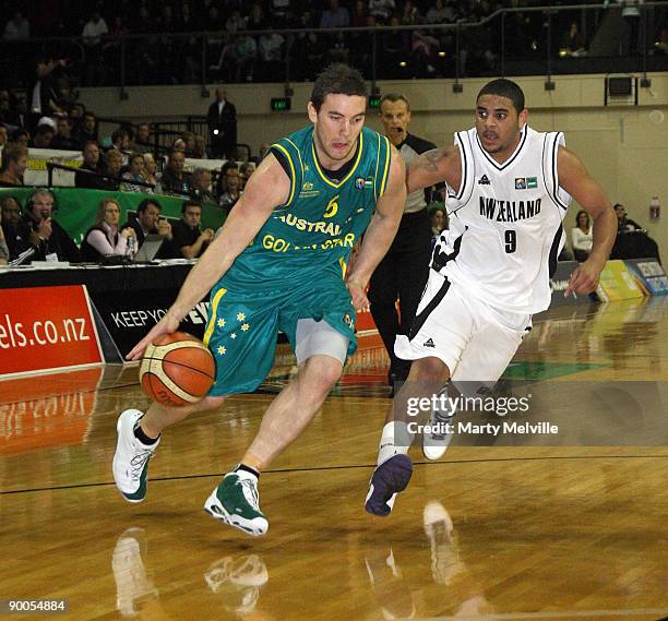 Adam Gibson of the Boomers dribles the ball with Corey Webster of the Tall Blacks in defense during game two of the Ramsey Shield series between the...