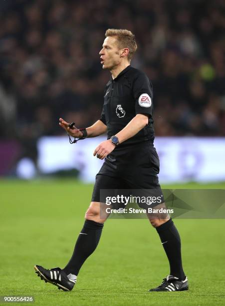 Referee Mike Jones gestures during the Premier League match between West Ham United and West Bromwich Albion at London Stadium on January 2, 2018 in...