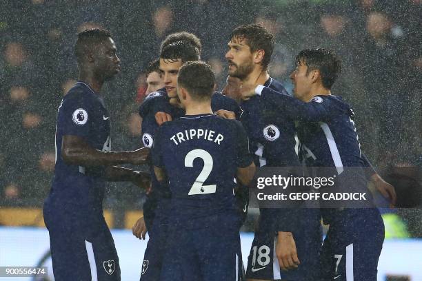 Tottenham Hotspur's Spanish striker Fernando Llorente celebrates with teammates after scoring the opening goal of the English Premier League football...