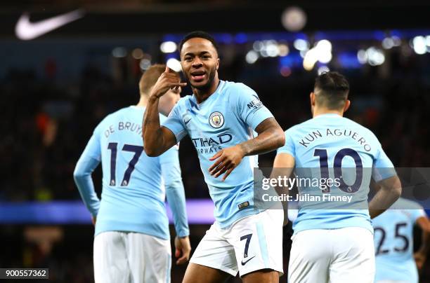 Raheem Sterling of Manchester City celebrates after scoring his sides first goal during the Premier League match between Manchester City and Watford...