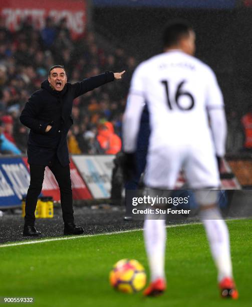 Carlos Carvalhal, Manager of Swansea City gives his team instructions during the Premier League match between Swansea City and Tottenham Hotspur at...