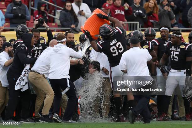 South Carolina Gamecocks defensive lineman Ulric Jones and South Carolina Gamecocks defensive lineman Keir Thomas dump a bucket of water on South...