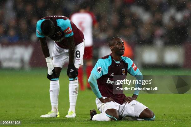 Cheikhou Kouyate of West Ham United and Pedro Obiang of West Ham United look dejeted during the Premier League match between West Ham United and West...