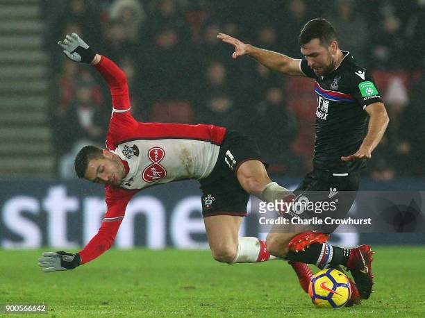 Dusan Tadic of Southampton is tackled by James McArthur of Crystal Palace during the Premier League match between Southampton and Crystal Palace at...