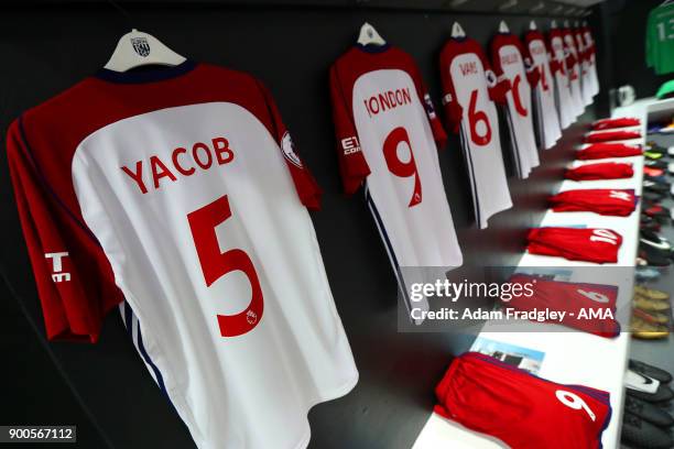 Claudio Yacob of West Bromwich Albion match kit hangs with team mates kit in the away dressing room during the Premier League match between West Ham...