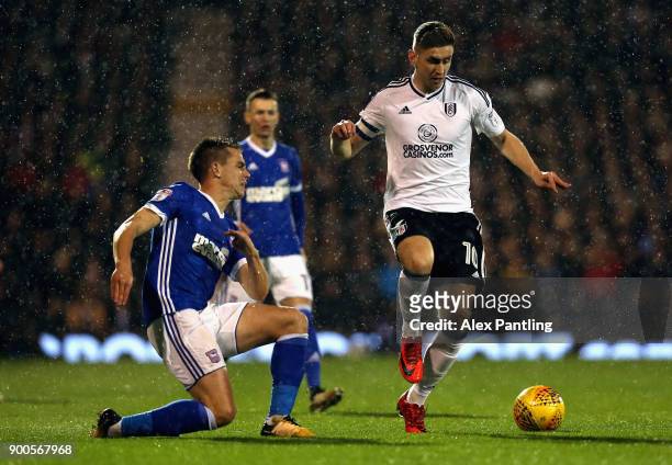 Tom Cairney of Fulham skips past Cole Skuse of Ipswich during the Sky Bet Championship match between Fulham and Ipswich Town at Craven Cottage on...