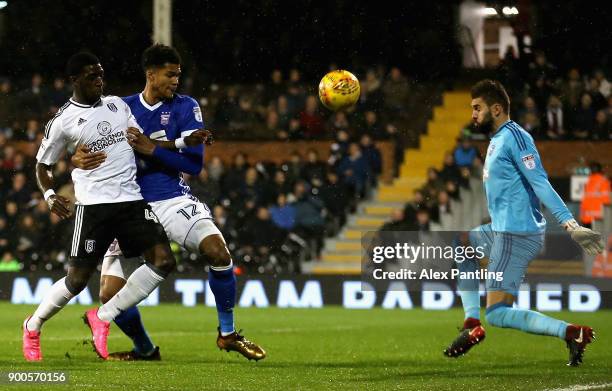 Aboubakar Kamara of Fulham shoots on goal under pressure from Jordan Spence of Ipswich during the Sky Bet Championship match between Fulham and...