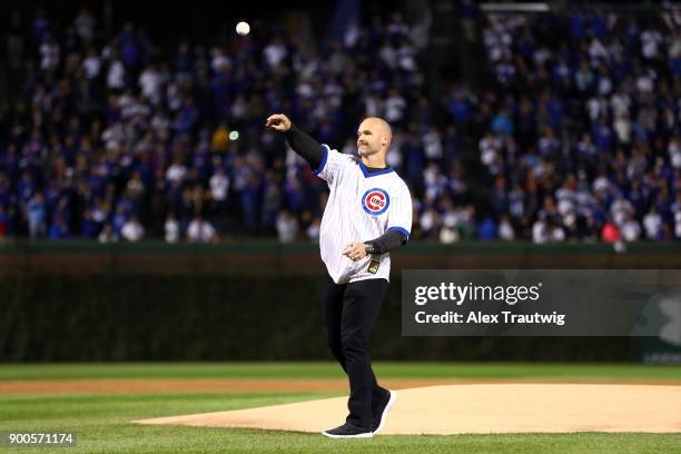 Former Cub David Ross throws out the ceremonial first pitch prior to Game 5 of the National League Championship Series between the Los Angeles...